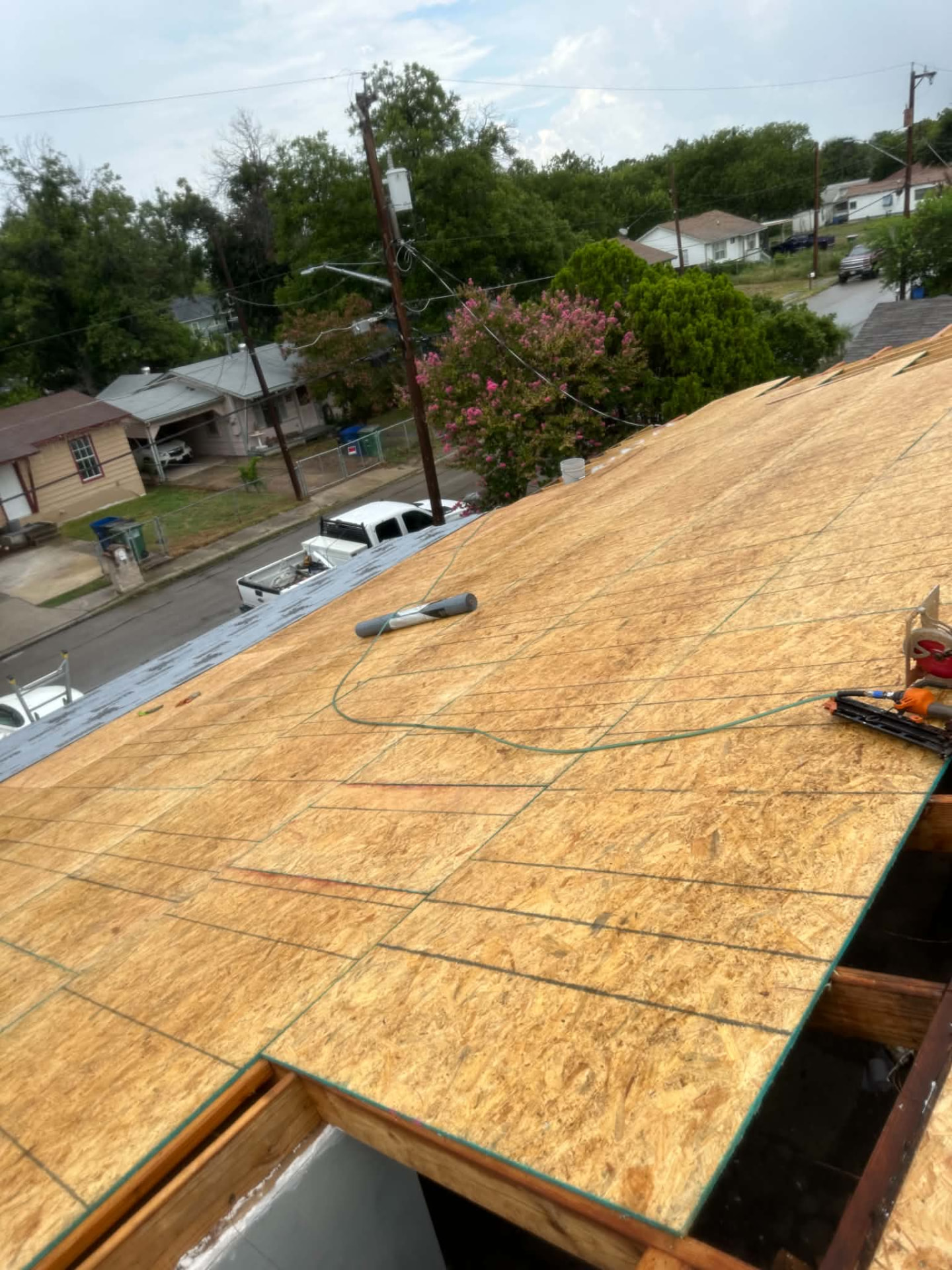 New wood panel decking across the roof